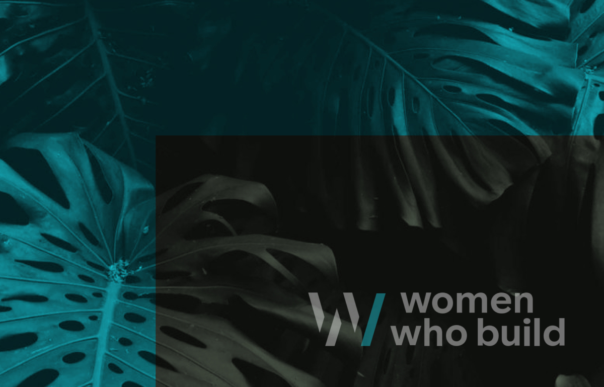 Women Who Build logo against cyan foliage.